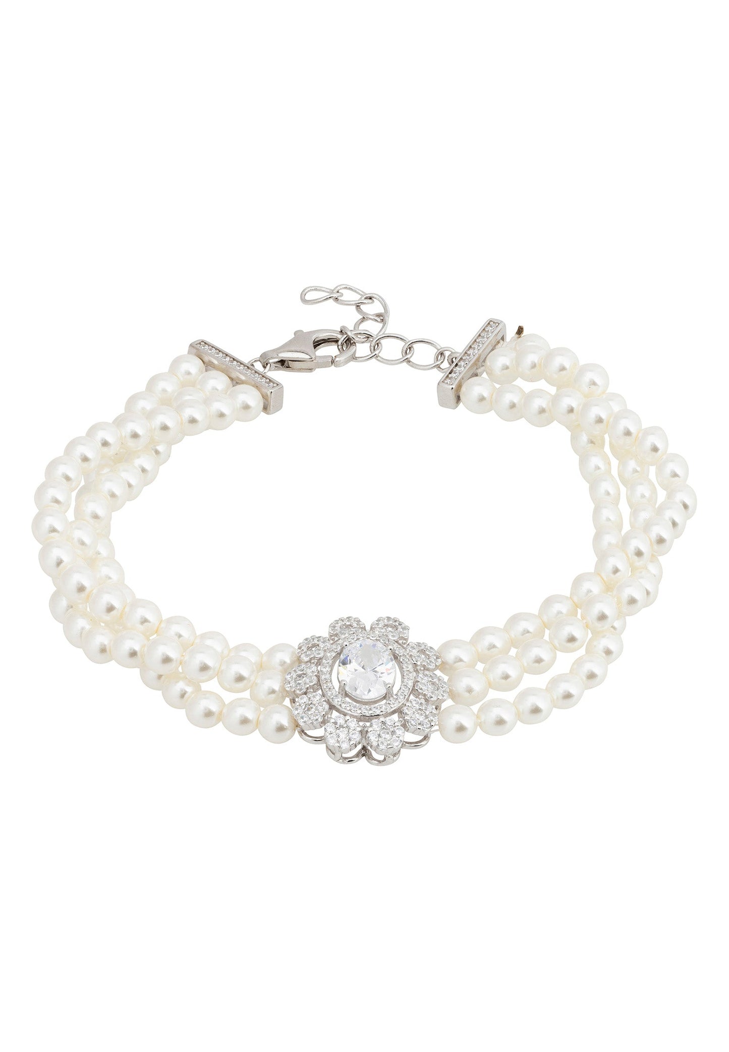 A silver-plated pearl strand bracelet with a floral motif centerpiece and sparkling stones.