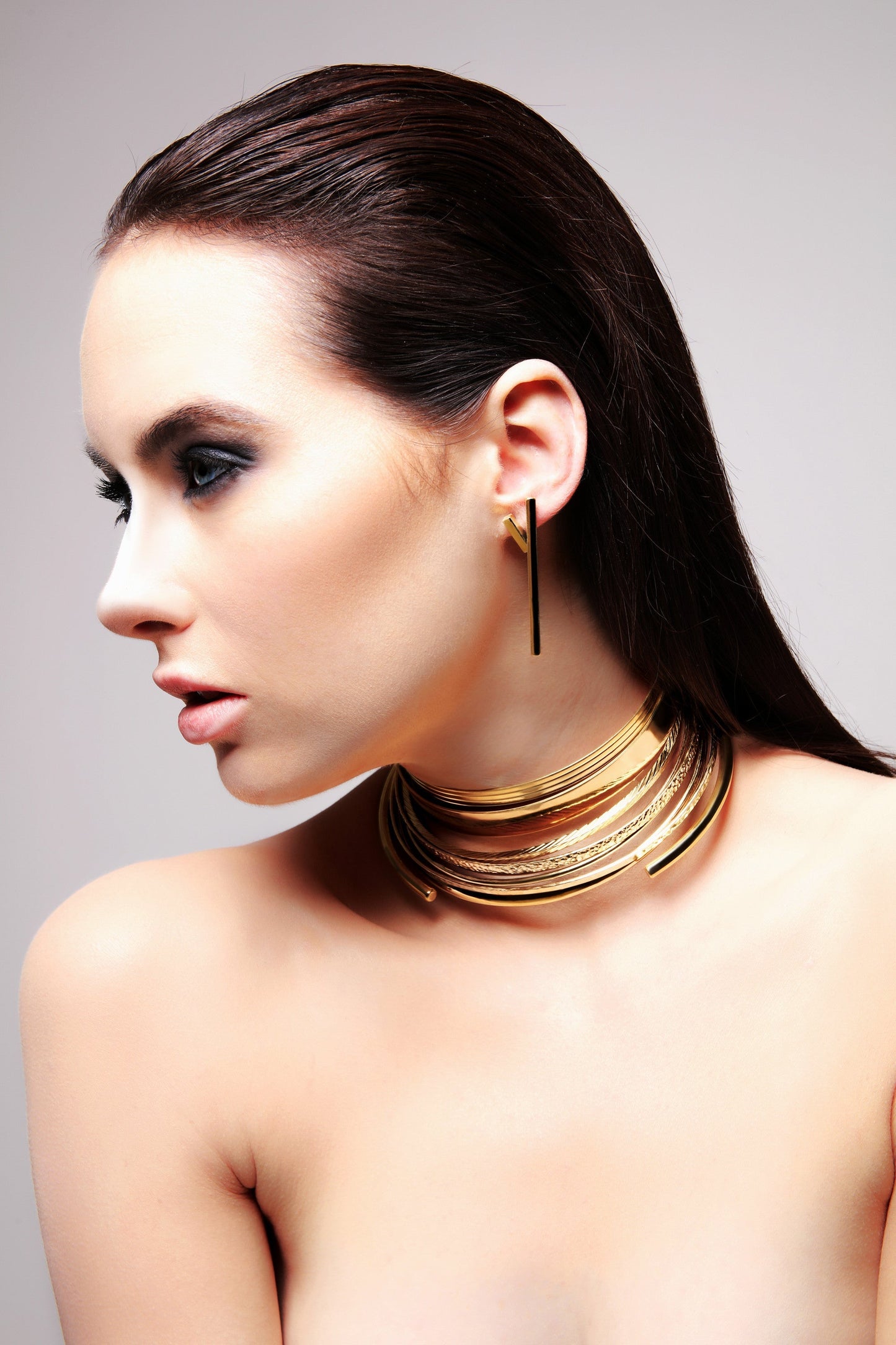Brass stick earrings with gold finish