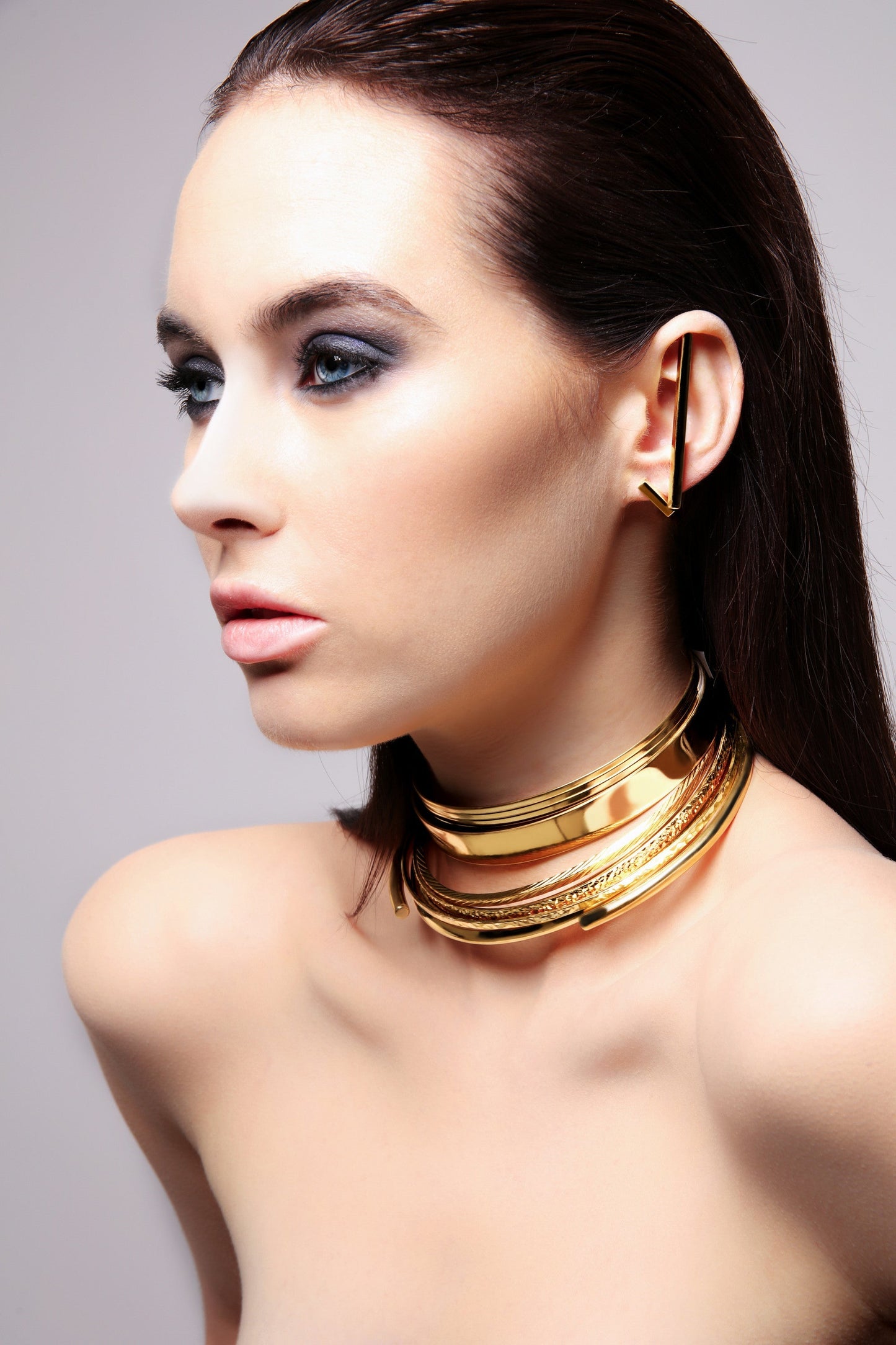 Brass stick earrings with gold finish