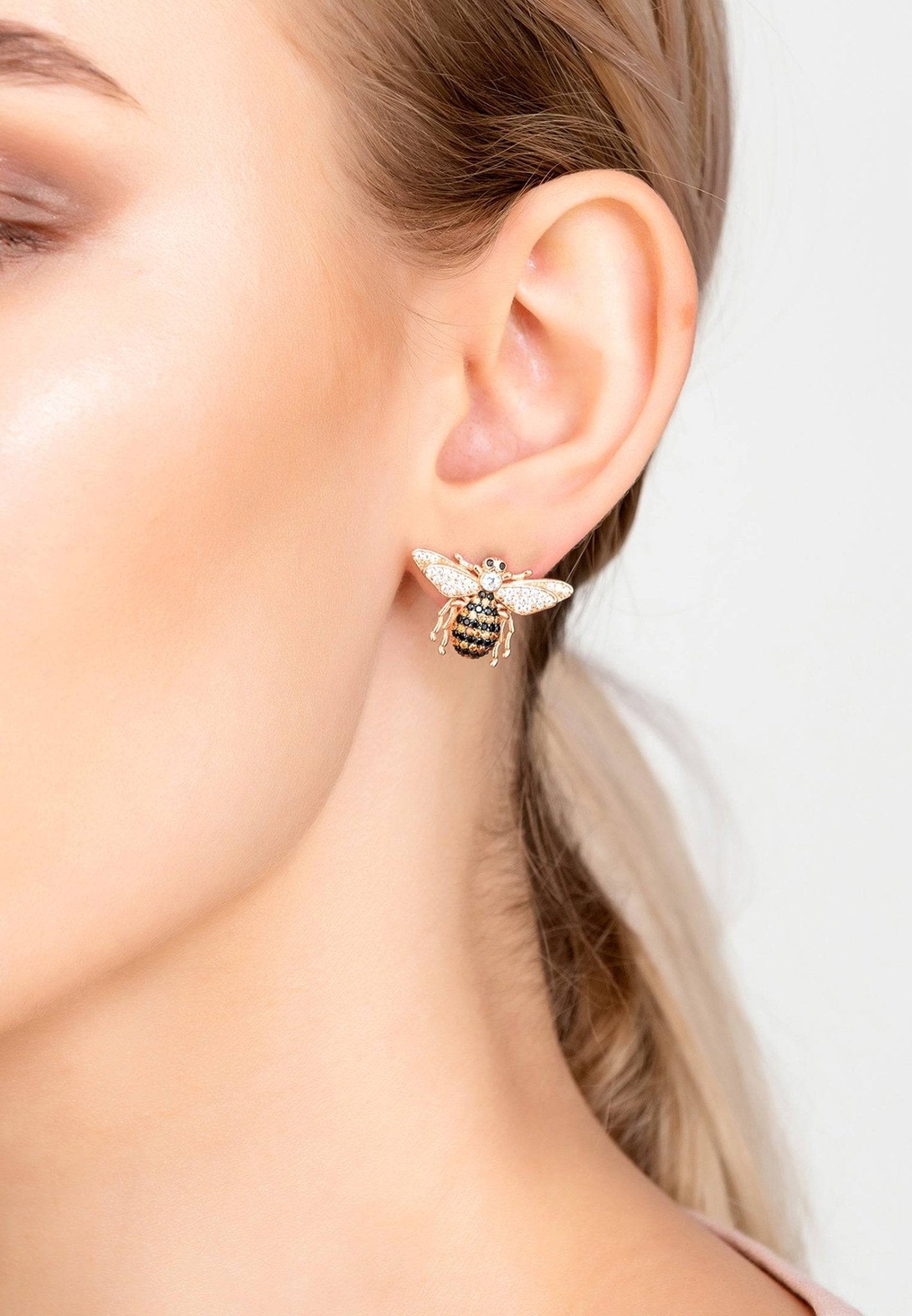 Playful rose gold honey bee studs