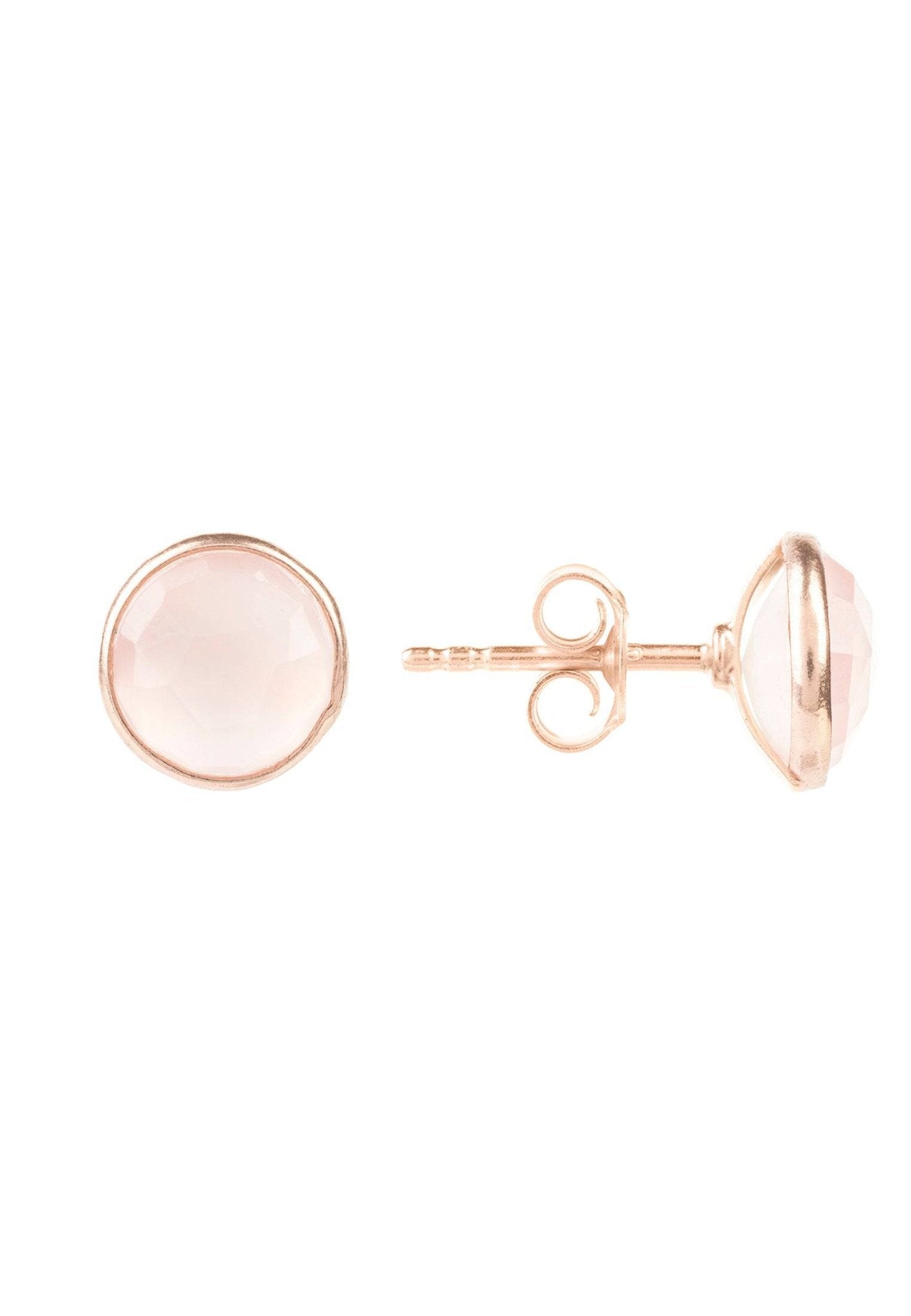 Rose gold circular earrings on a white background