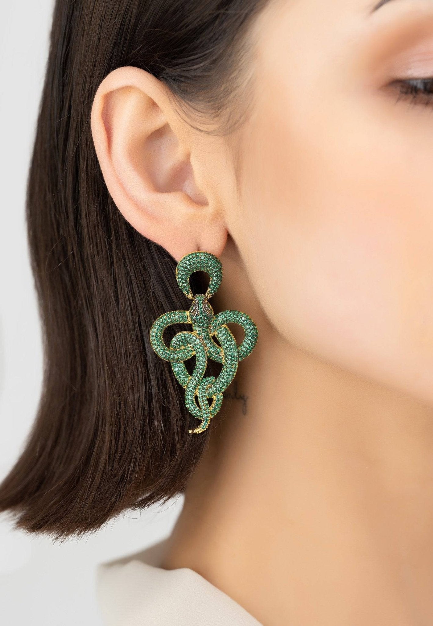 Viper snake drop earrings gold emerald