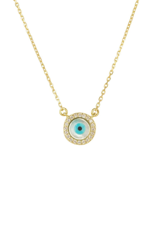 A gold-colored necklace with a central mother of pearl evil eye design, surrounded by white zircons, on a white background.